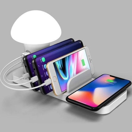 Versatile Charging Station for Daily Home Device Needs showing wireless pad and three USB ports charging multiple phones and a tablet on a nightstand