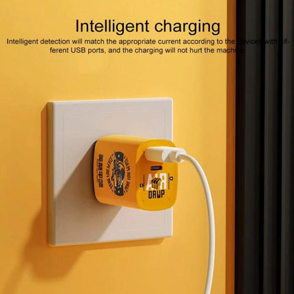 Rock Travel Charger for Everyday and Travel Device Use plugged into wall outlet, yellow compact charger charging phone and tablet