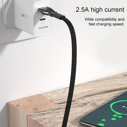 WK USB Cable for Daily Phone Charging and Data Syncing braided cable plugged into wall charger next to smartphone showing charging screen
