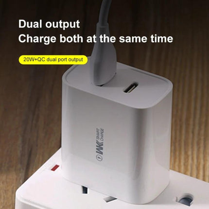A Portable USB-C Charger for Your Everyday Device Needs shown dual-output compact white charger plugged into power strip, fits in pocket
