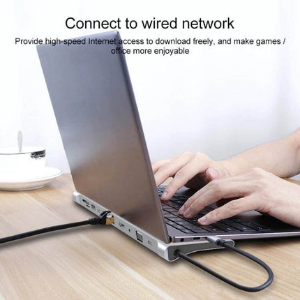 11-in-1 Type-C Hub Adapter for Device Connectivity connected to laptop showing Ethernet, HDMI and USB ports for work and presentations