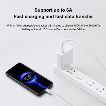 Xiaomi USB to USB-C Cable for Daily Device Charging connected to phone showing fast charging and white charger on power strip