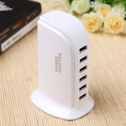 Efficient Multi-Port USB Charger for Daily Device Needs — white vertical 6-port USB power adapter on desk for phones, tablets, earbuds