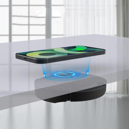 Under-Desk Charger for Daily Home and Office Workstations attached under desk wirelessly charging a smartphone with magnetic alignment