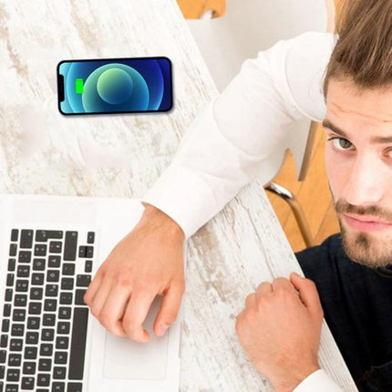 Under-Desk Charger for Daily Home and Office Workstations showing phone wirelessly charging under desk near laptop