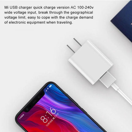 Xiaomi Wall Charger for Daily Use at Home and Travel - compact white USB charger next to smartphone for home and travel charging