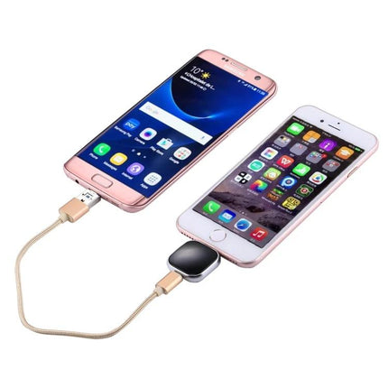 Essential Flash Drive for Managing Phone Files on the Go connected to two phones for photo backup and media playback