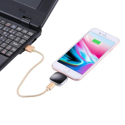 Essential iPhone Flash Drive for Everyday File Storage and Backup connected to iPhone charging via laptop for on-the-go photo and file backup