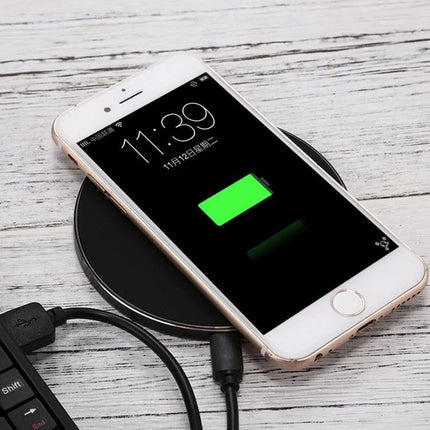 Compact Q21 Charger for Daily Home and Travel Use showing smartphone charging on a compact wireless pad, ideal for home and travel