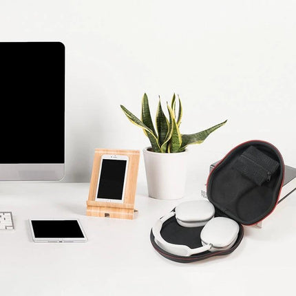 Compact Bag for Protecting Earphones During Daily Travel on desk with headphones, phone, tablet—EVA shock-resistant travel case for organized commutes