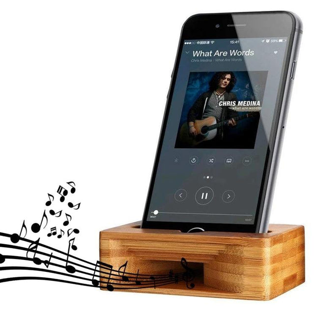 Natural Bamboo Universal Desktop Phone Stand for Smartphones holding smartphone on desk for hands-free viewing and music playback