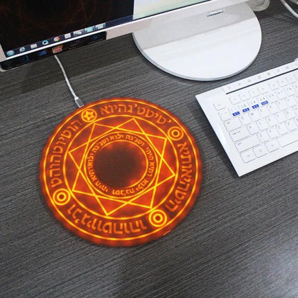 Wireless Charger for Daily Home and Travel Essentials glowing circular rune design on desk next to keyboard and monitor