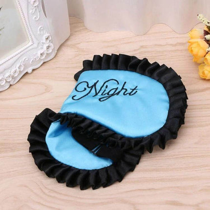 Imitation Silk Sleep Mask For Travel And Home Use Soft And Breathable blue ruffled eye mask with "Night" embroidery for travel and home
