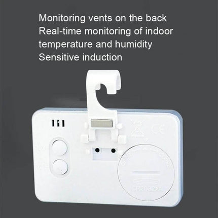 Indoor Thermometer Humidity With Digital Display For Home Use compact white monitor showing back with hook, battery compartment and vents