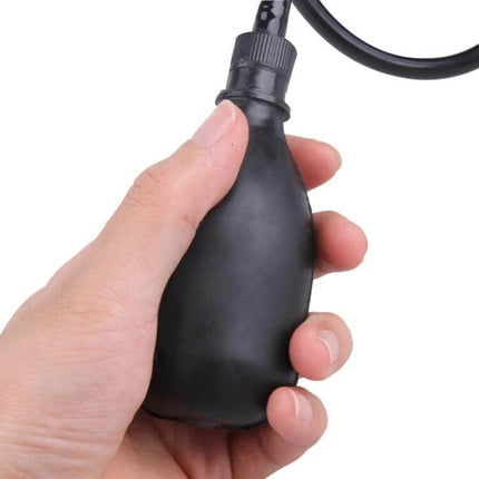 Inflatable Cervical Neck Traction Device Dark Blue hand-held pump close-up showing inflatable mechanism and ergonomic drop-shaped design