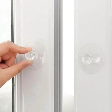 Invisible Cabinet Drawer Handle 2 Pack With Self Adhesive Suction Cups on white cabinet showing clear acrylic suction handle applied