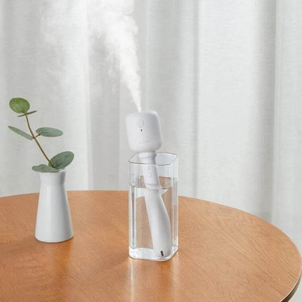 JisuLife Wireless High Mist Portable Humidifier White No Water Tank portable desk scene producing nano-fine mist in a glass for travel and workstation use
