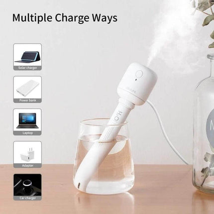 JisuLife Wireless High Mist Portable Humidifier White No Water Tank shown misting from a glass with USB charging options for travel and desk use