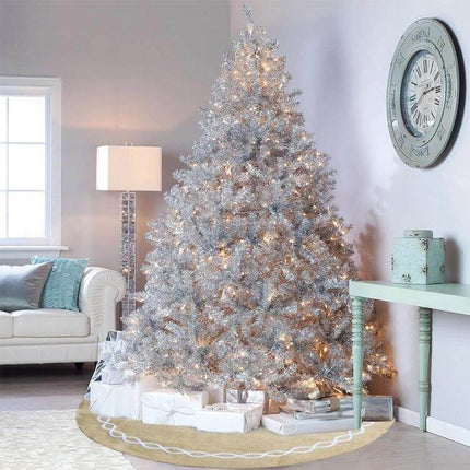 Jute Cloth Tree Skirt 122 Cm Diameter For Christmas Tree under silver lit tree in cozy living room with wrapped gifts