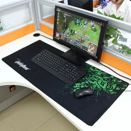 Extended Large 90cm x 40cm Mouse Pad for Gaming and Office on desk with keyboard, mouse and monitor showing MOBA gameplay