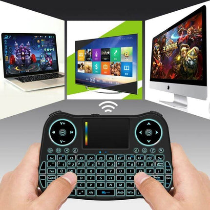 Mini Wireless Air Mouse with QWERTY Keyboard for TV and PC in hands controlling smart TV and PC