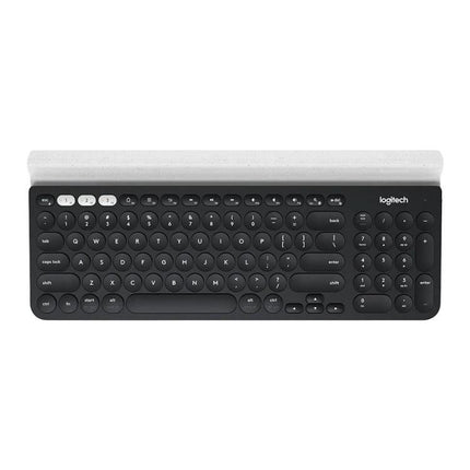 Logitech K780 Multi-Device Wireless Keyboard for Easy Typing shown in black with cradle for phone and tablet, 3-device switching and compact layout