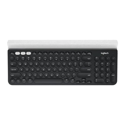 Logitech K780 Multi-Device Wireless Keyboard for Easy Typing shown in black with round keys and device cradle for switching between computer, tablet, smartphone