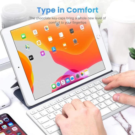 Wireless Bluetooth Keyboard with Portuguese Layout slim white Bluetooth keyboard used with tablet for typing emails browsing and document editing
