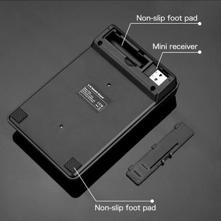 MC Saite Wireless 19-Key Numeric Keyboard for Everyday Computing showing underside with mini receiver storage, non-slip foot pads and detachable stand
