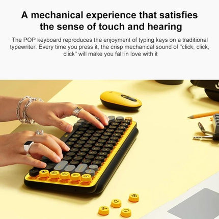 Logitech POP Keys Round Button Bluetooth Mechanical Keyboard in yellow with round keycaps and hands typing, multi-device Bluetooth and Easy-Switch feature