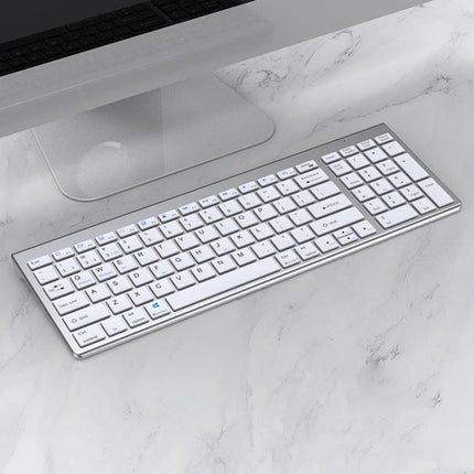 Three-Mode Wireless Bluetooth Keyboard for Everyday Typing slim white keyboard on marble desk with computer, noise-reduction design and multitasking device switching