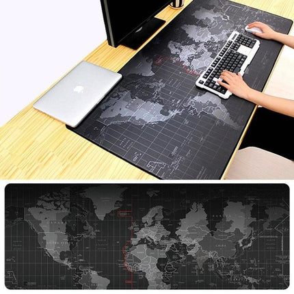 Large World Map Pattern Mouse Pad for Desk and Gaming, 80 x 30cm on desk with keyboard and laptop, black world map surface for gaming and office use