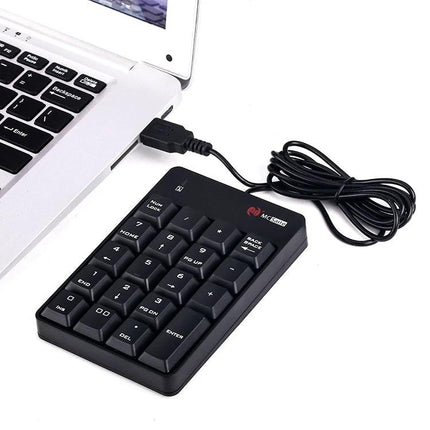 MC Saite 19-Key Wired Numeric Keyboard for Everyday Computing connected to laptop via USB, compact black keypad for spreadsheet and accounting input