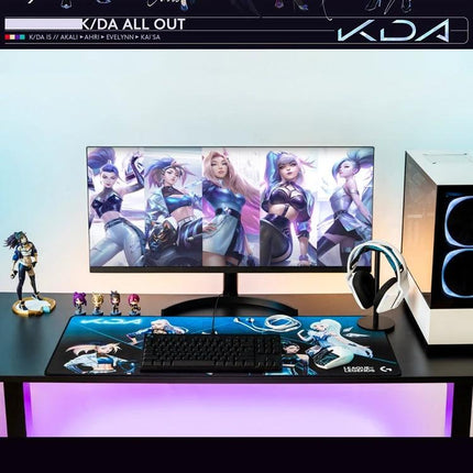Logitech Wireless Gaming Mouse for Everyday Computing pictured beside ultrawide monitor, keyboard, headset, and gaming PC in a clean desktop setup