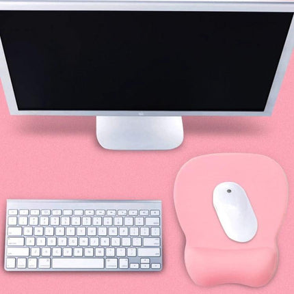 Montian Soft Memory Foam Oval Mouse Pad for Daily Use shown in pink with white mouse and keyboard on desk