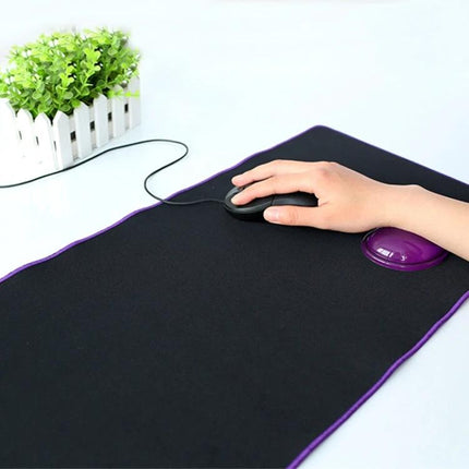 MONTIAN Heart-Shaped Silicone Wrist Supporter for Mouse Use, 2 Pack shown in use with hand on mouse on black mousepad