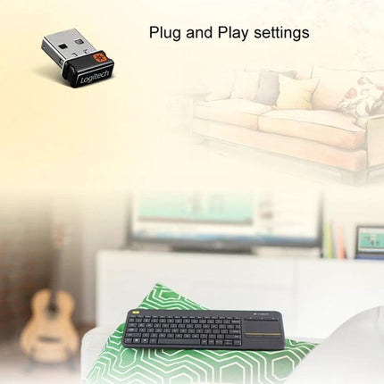 Logitech K400 Plus Wireless Keyboard for Living Room Navigation with built-in touchpad and USB receiver shown on living room couch
