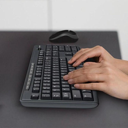 Logitech Wireless Keyboard and Mouse Set for Daily Computing showing full-size keyboard and compact mouse with hands typing
