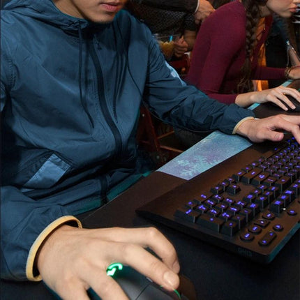 Logitech White Wired RGB Gaming Mouse for Everyday Precision Control in use with RGB keyboard at gaming setup