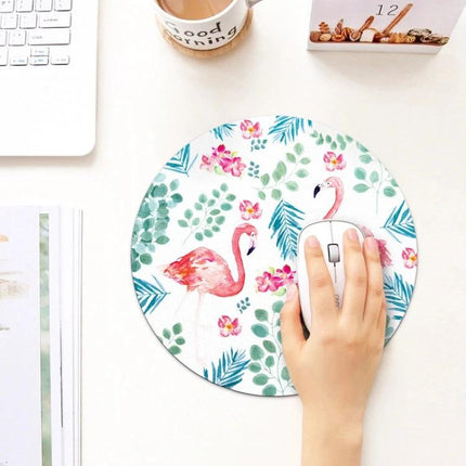 Circular Flamingo Pattern Mouse Pad for Everyday Computing showing round flamingo print mouse pad with hand using white mouse on desk