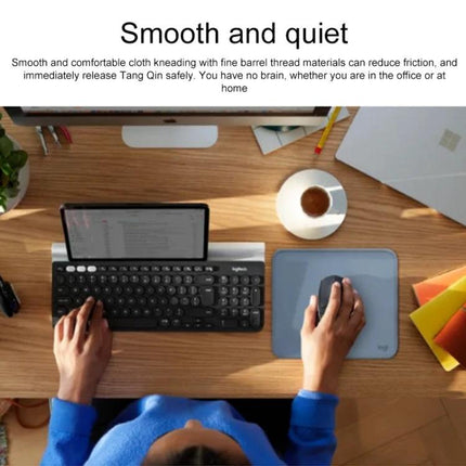 Logitech Soft Surface Mouse Mat for Comfortable Daily Use shown on a desk with keyboard, cup of coffee, and hand using a mouse
