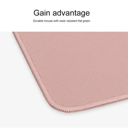Logitech Soft Surface Mouse Mat for Comfortable Daily Use — pink soft-surface mouse mat corner showing fine woven texture and stitched edge