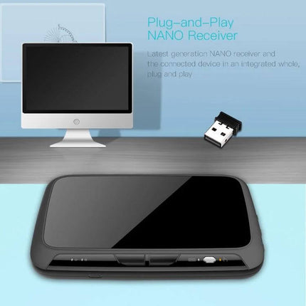 H18+ Compact Wireless Keyboard for TV Control with Touchpad showing touchpad surface and nano USB receiver next to a monitor