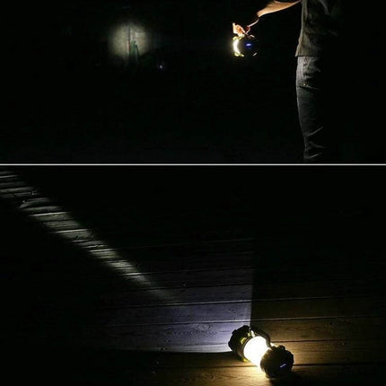 KINSACH Portable LED Searchlight for Outdoor Camping shown illuminating a dark campsite and wooden deck with long-range beam