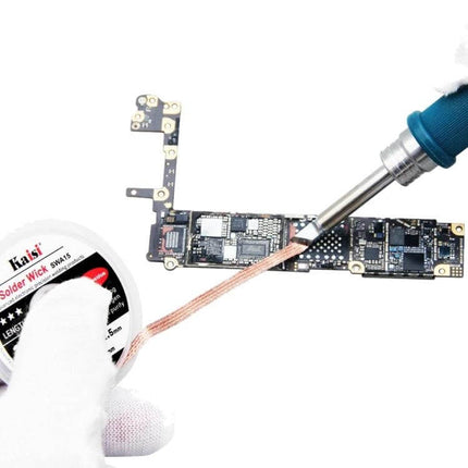 Kaisi Tin Suction Tape Cleaning Belt For Soldering Iron being used to clean solder from a PCB with a soldering iron