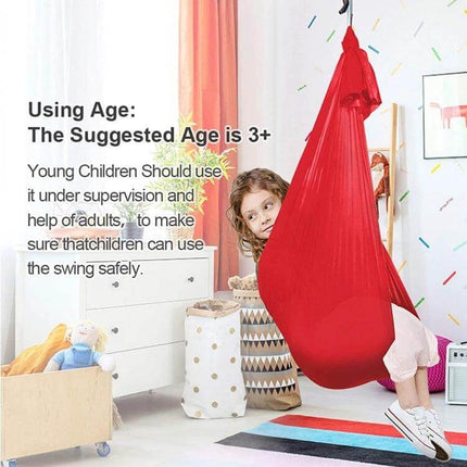 Kids Elastic Hammock Swing 100x280 cm in red stretch satin with sturdy hardware shown in a child’s playroom, indoor swing supporting supervised lounging and light swinging