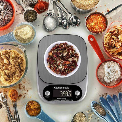 Kitchen Scale For Everyday Cooking Tasks, 5kg Capacity - stainless steel digital kitchen scale showing 398.5g with spices and measuring spoons