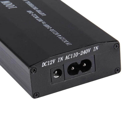 Universal 100W Laptop Charger with Multiple Adapters for Devices black power brick showing DC12V and AC100-240V input ports