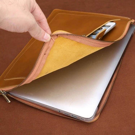 Genuine Leather Protective Sleeve for 11.6 Inch Laptops and Tablets – tan zippered sleeve holding laptop and phone