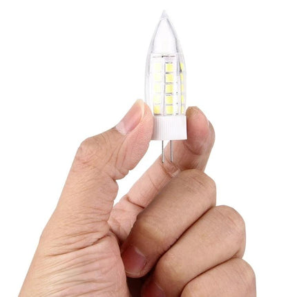 Bulb for Everyday Home Lighting and Interior Decoration held between fingers, LED candle bulb for living room and kitchen lighting